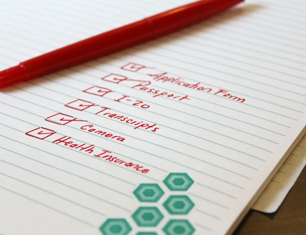 A handwritten document checklist for studying abroad